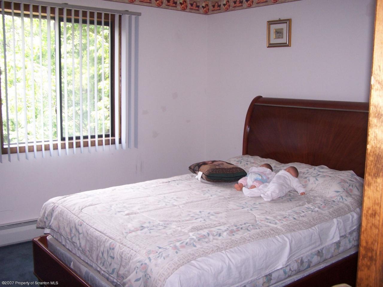 3300 Northgate Road Lake Ariel, PA 18436 - Photo 6 of 11 a bedroom with a bed and a window