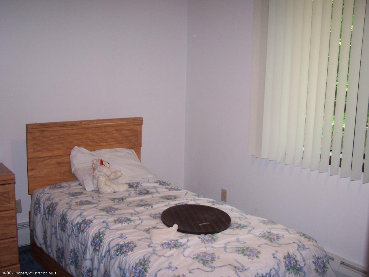3300 Northgate Road Lake Ariel, PA 18436 - Photo 7 of 11 a bedroom with a bed and a window