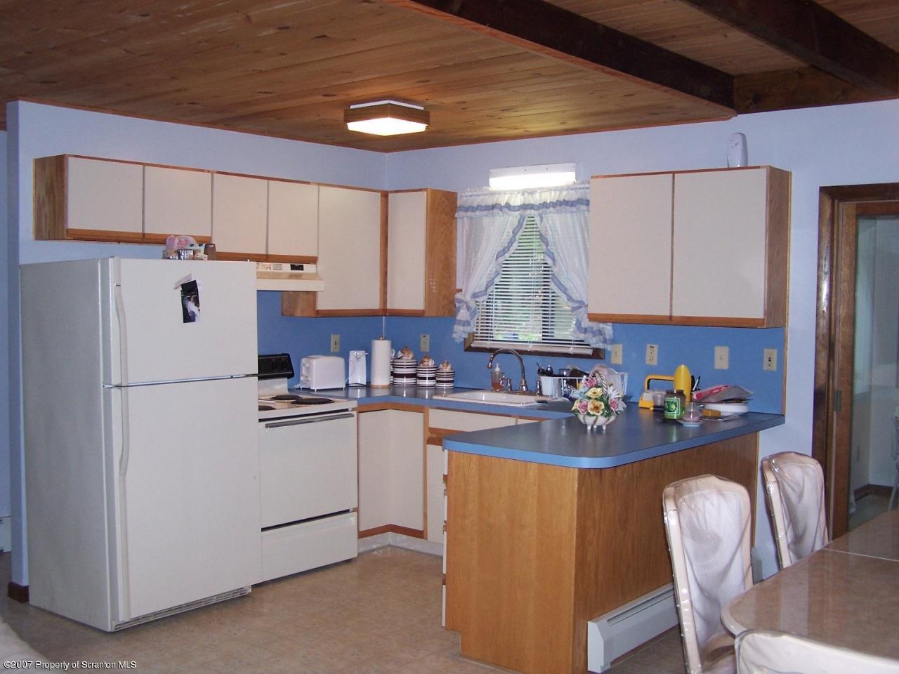 3300 Northgate Road Lake Ariel, PA 18436 - Photo 9 of 11 a kitchen with refrigerator and cabinets