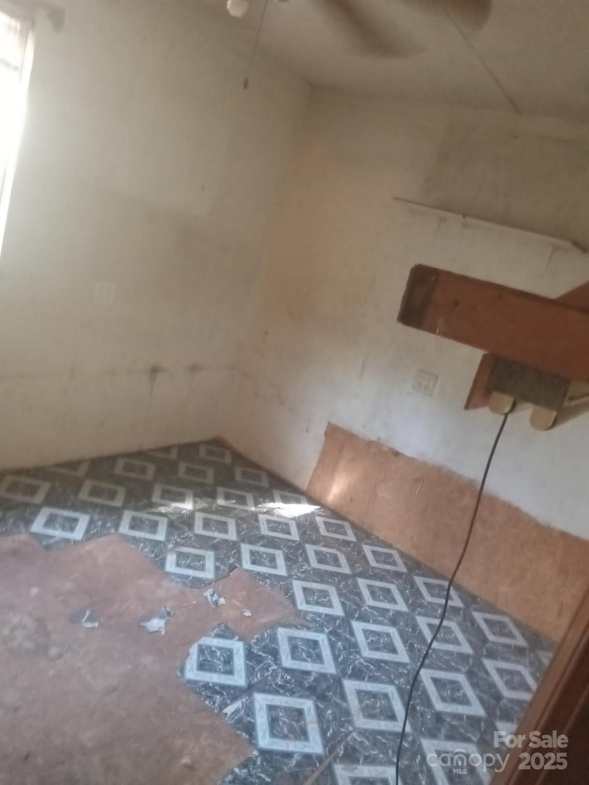 74 Lighthouse Lane Mill Spring, NC 28756 - Photo 2 of 13 a view of empty room with wooden floor