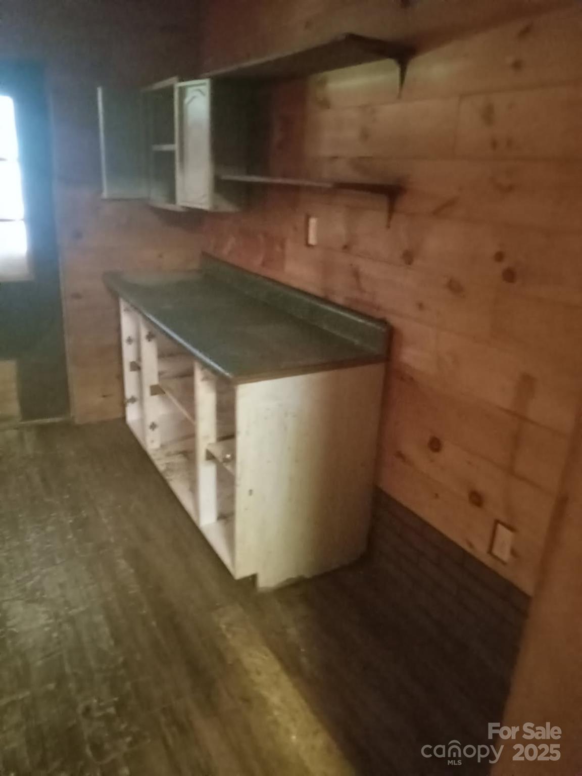 74 Lighthouse Lane Mill Spring, NC 28756 - Photo 9 of 13 a kitchen with a sink and cabinets