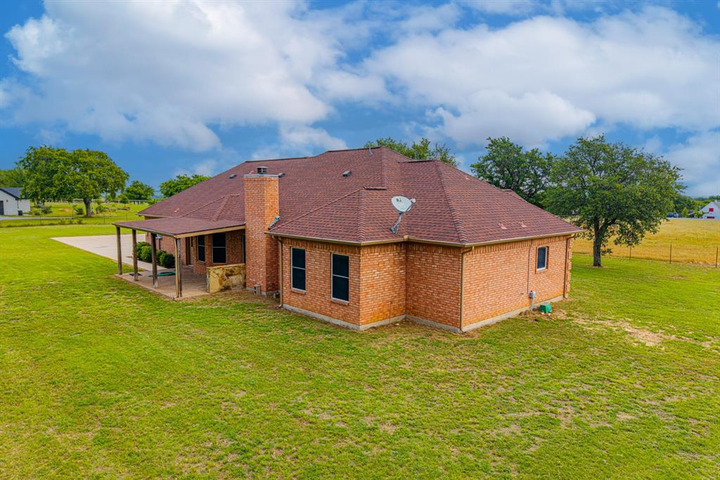 483 Christy Kay Lane Rhome, TX 76078 - Photo 38 of 40 an aerial view of residential houses with yard and swimming pool