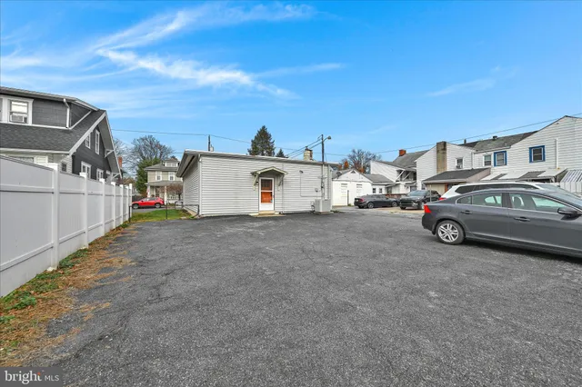 a view of a car park in front of house