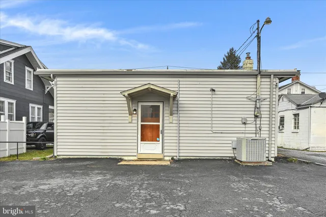 a view of a house with white walls