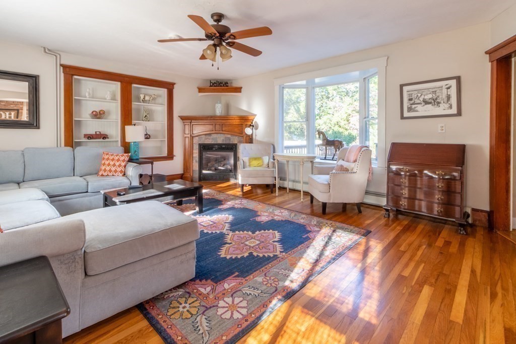 280 Boston Road Chelmsford, MA 01824 - Photo 9 of 24 a living room with furniture and a fireplace
