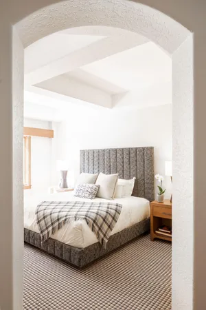 a living room filled with furniture and a flat screen tv