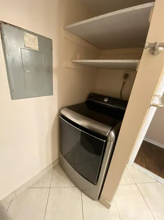 a utility room with washer and dryer
