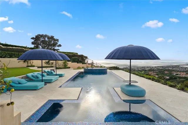 a living room with furniture a fireplace and a large window