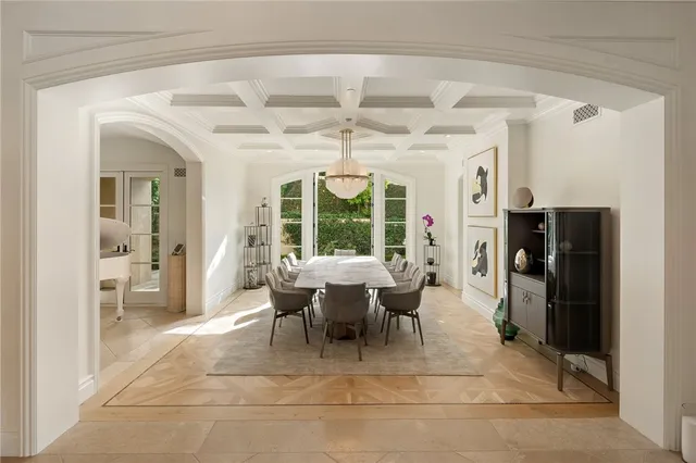 a large white kitchen with a sink and dishwasher stove top oven