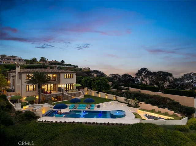 a swimming pool with outdoor seating and yard