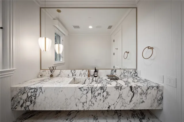 a bedroom with a large bed and a flat screen tv