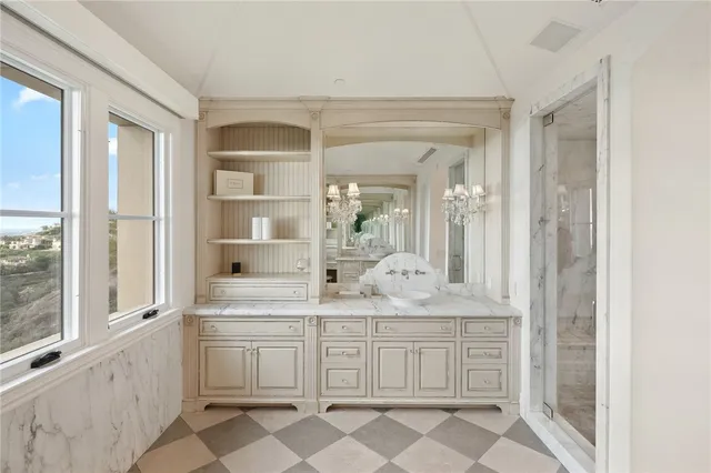 a bedroom with a large bed and a tv