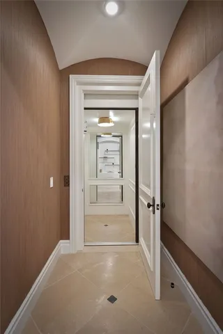 a bed room with a bed and a chandelier