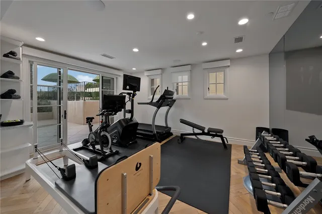 a view of a patio with a table and chairs under an umbrella