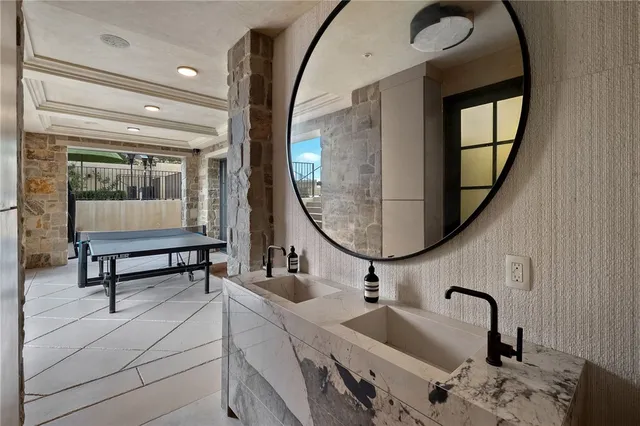 a view of a backyard with table and chairs and potted plants and large trees