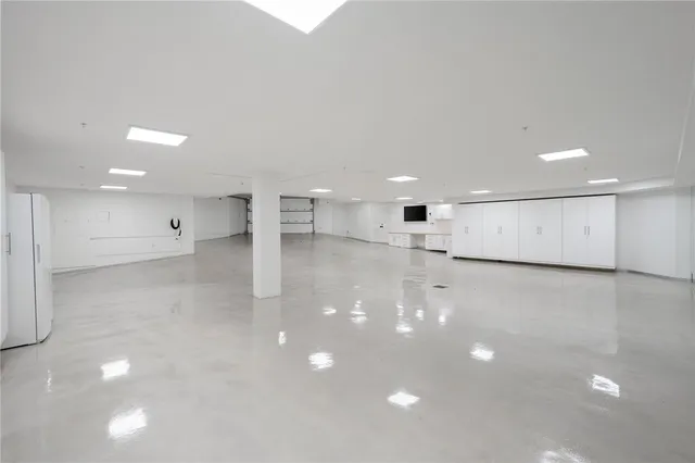 a view of swimming pool with seating area and furniture in the background