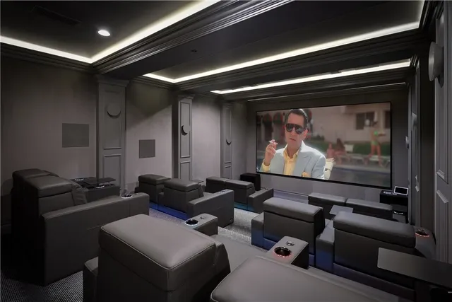 a view of a swimming pool with a table and chairs under an umbrella