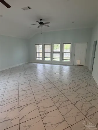 a view of empty room with windows