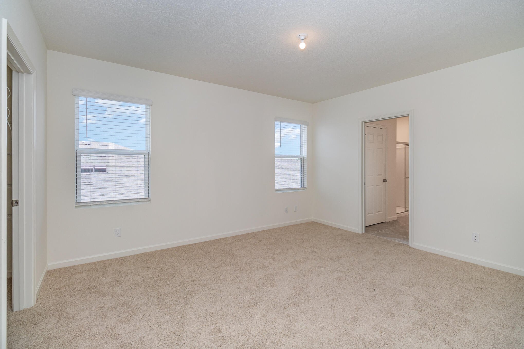 569 Seaspray Drive Fort Pierce, FL 34945 - Photo 11 of 28 an empty room with windows