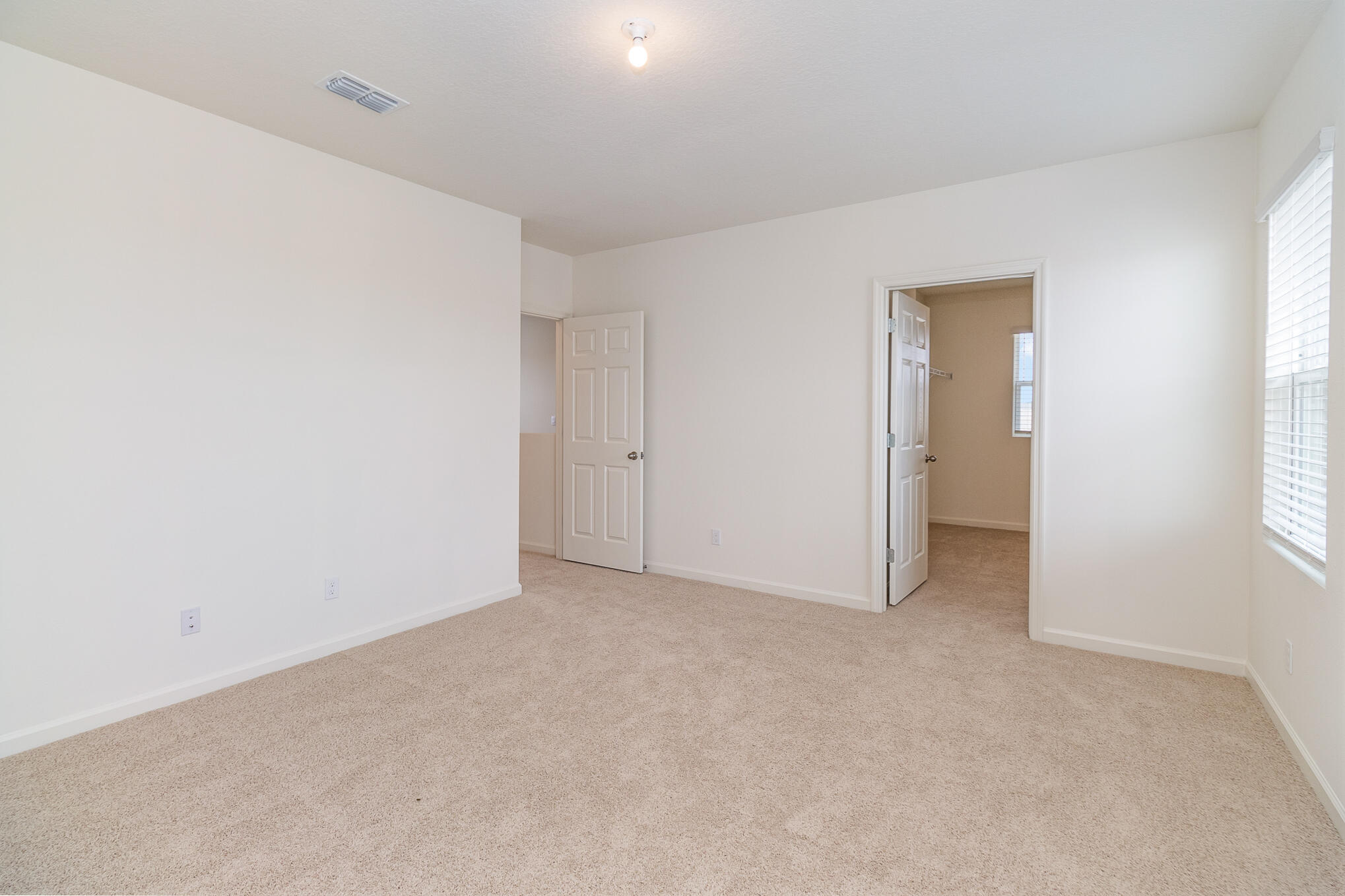 569 Seaspray Drive Fort Pierce, FL 34945 - Photo 12 of 28 a view of an empty room and a window