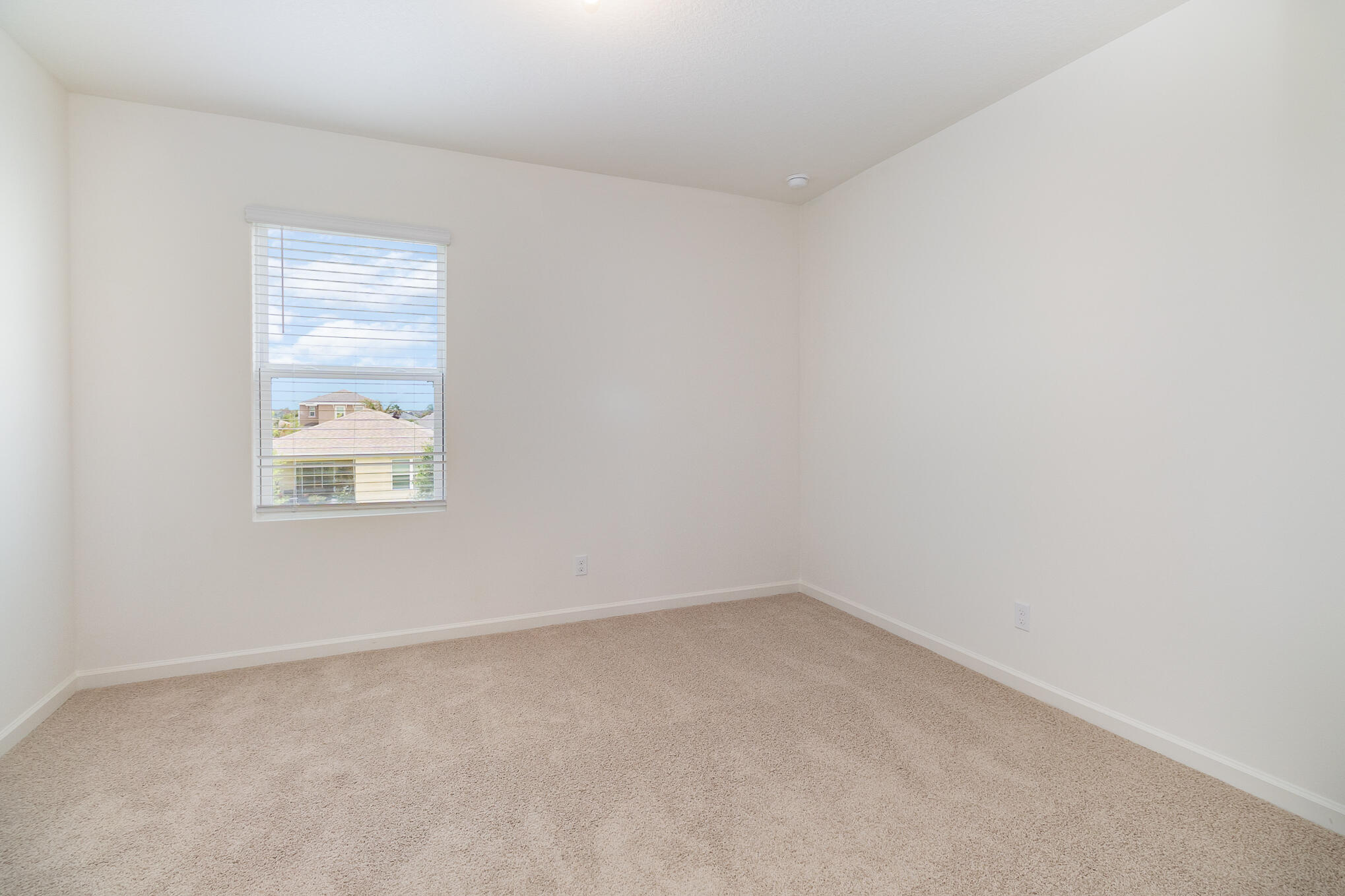 569 Seaspray Drive Fort Pierce, FL 34945 - Photo 13 of 28 an empty room with a window