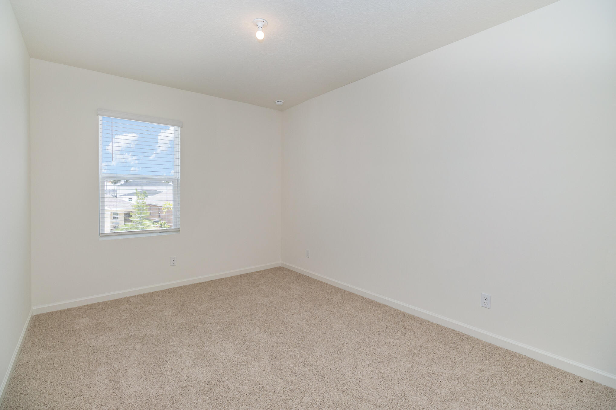 569 Seaspray Drive Fort Pierce, FL 34945 - Photo 14 of 28 an empty room with a window