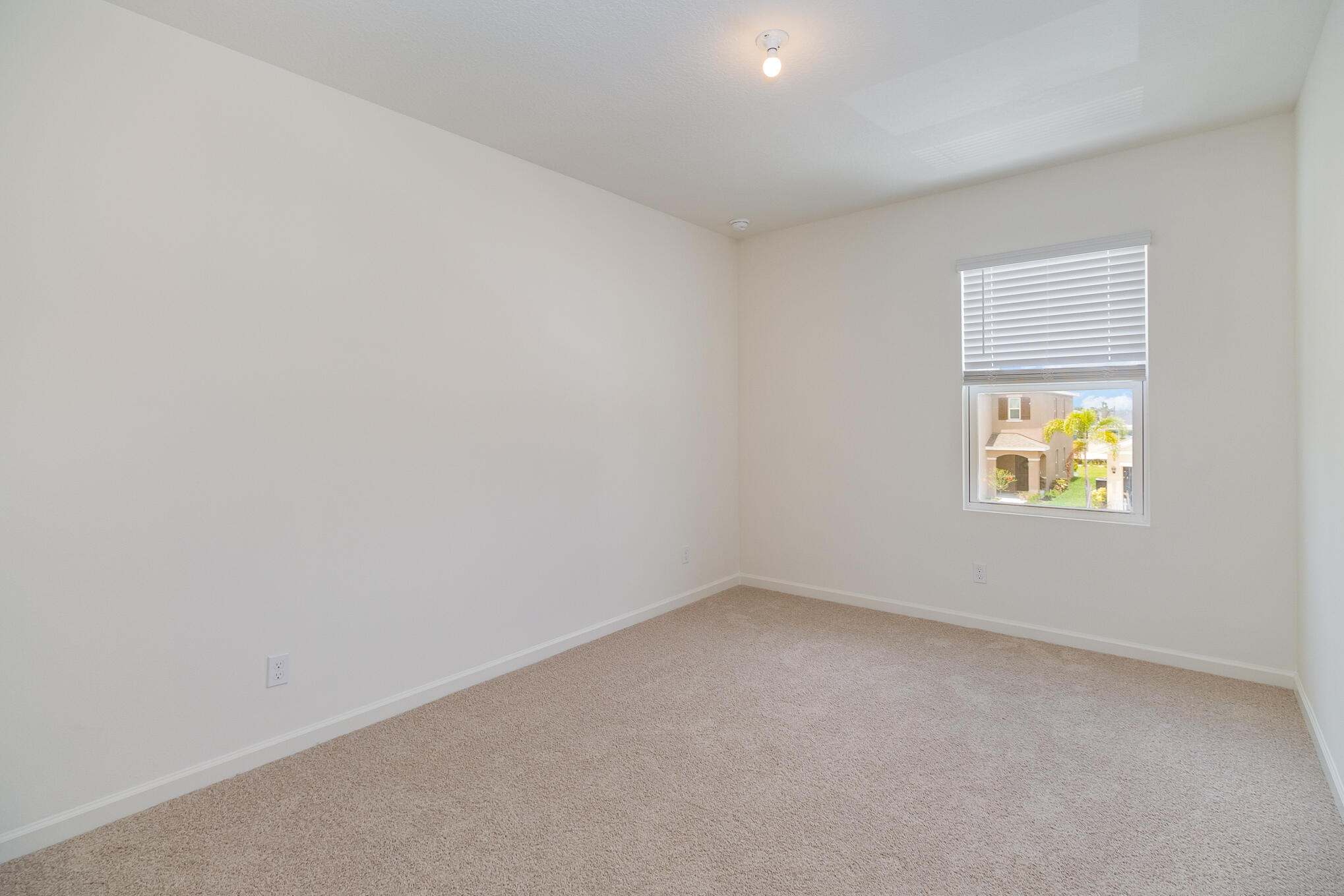 569 Seaspray Drive Fort Pierce, FL 34945 - Photo 17 of 28 a view of an empty room with a window