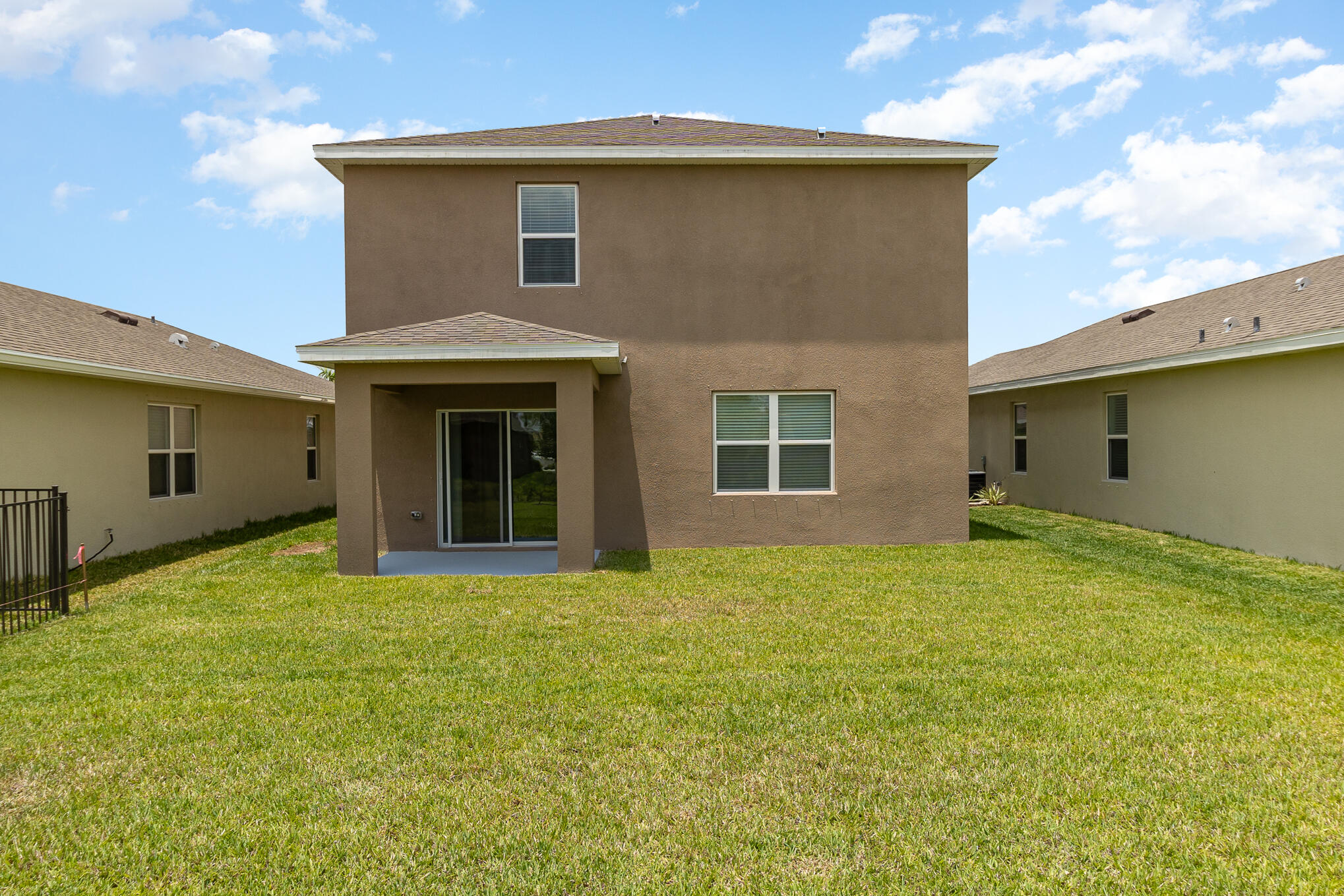 569 Seaspray Drive Fort Pierce, FL 34945 - Photo 19 of 28 a view of an house with backyard and garden