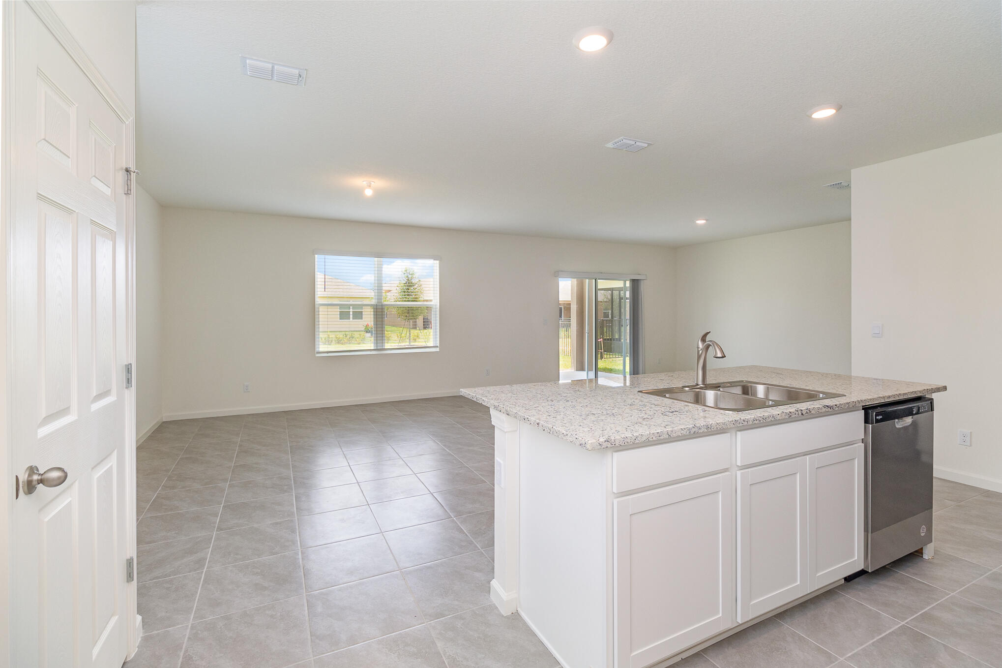 569 Seaspray Drive Fort Pierce, FL 34945 - Photo 7 of 28 a view of a kitchen counter space and windows