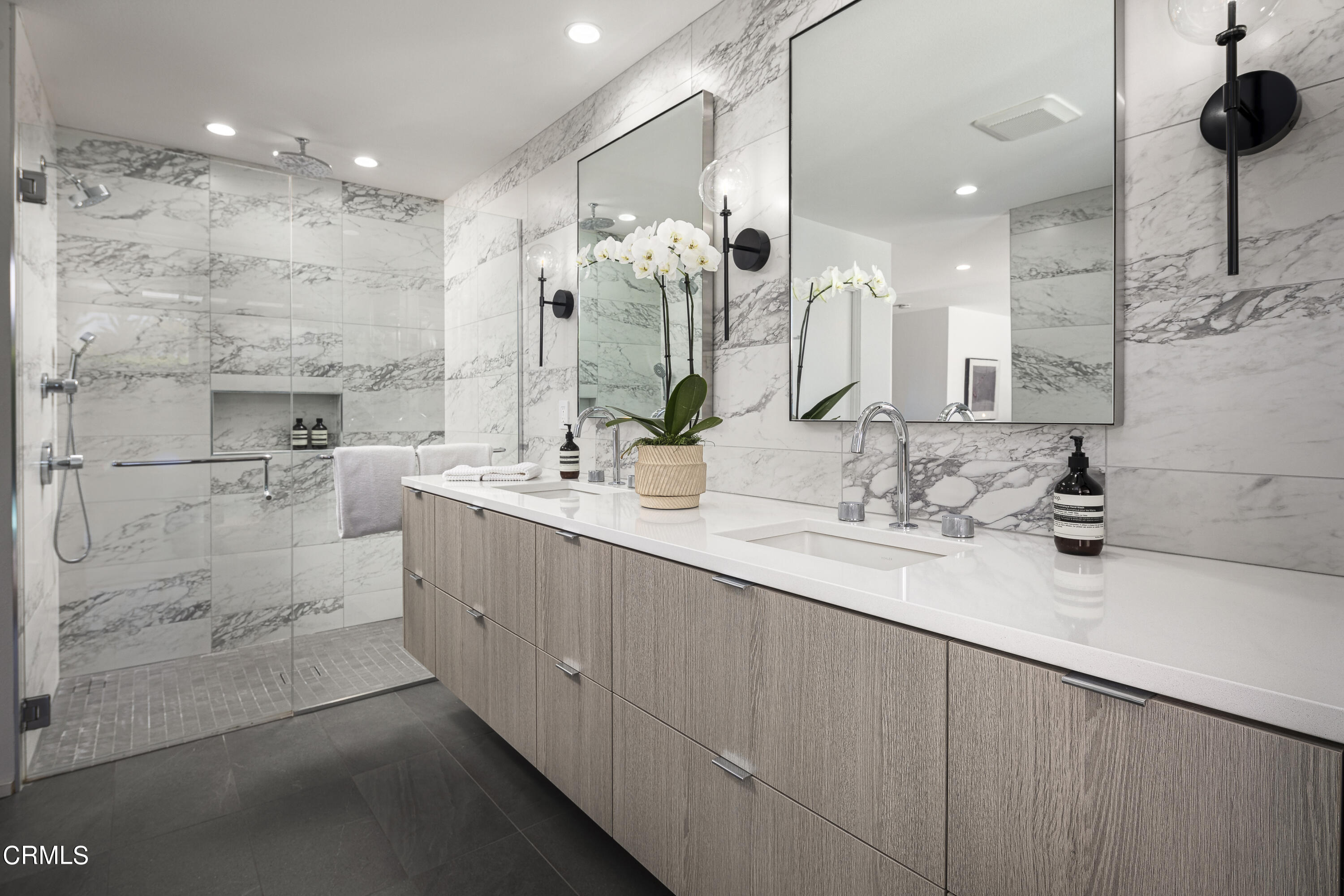 56 Princeton Drive Rancho Mirage, CA 92270 - Photo 18 of 35 a bathroom with a double vanity sink mirror and shower