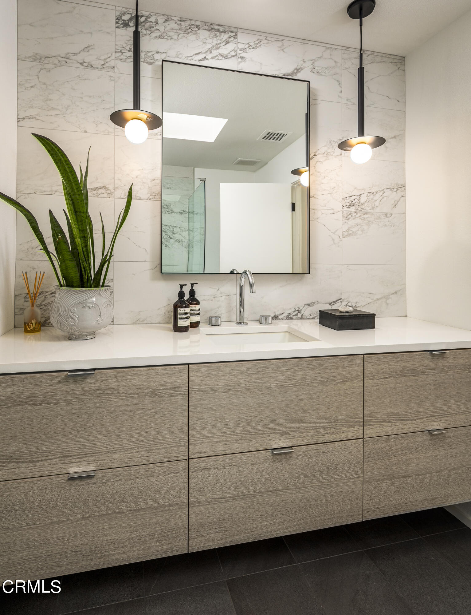 56 Princeton Drive Rancho Mirage, CA 92270 - Photo 25 of 35 a bathroom with a sink a vanity and a mirror