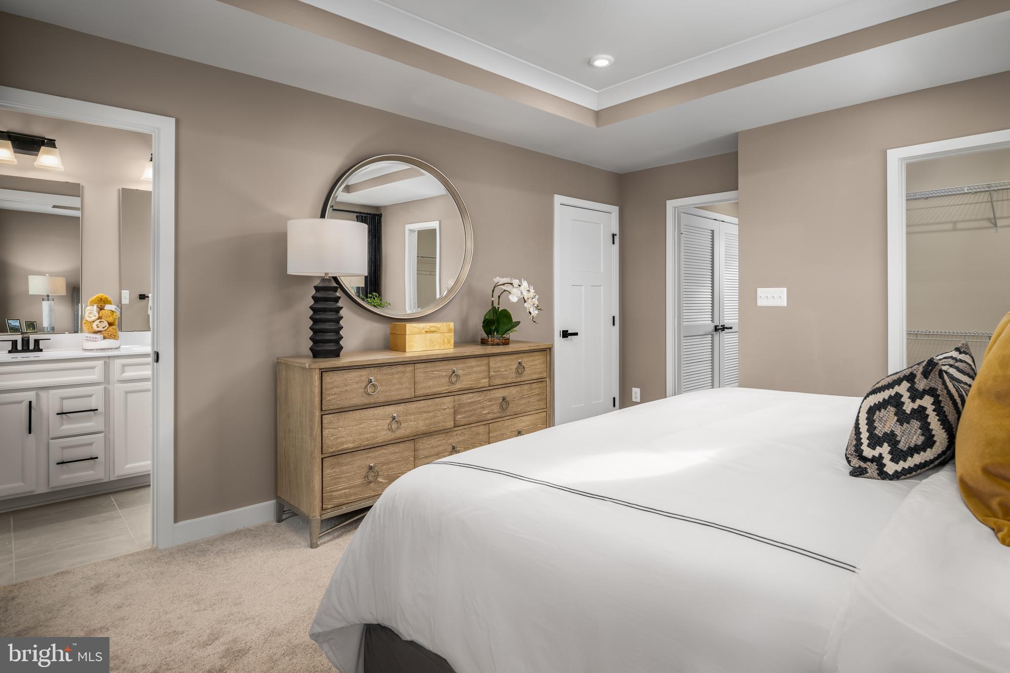 59 A Destrier Street Ranson, WV 25438 - Photo 14 of 17 a bedroom with a bed and a dresser