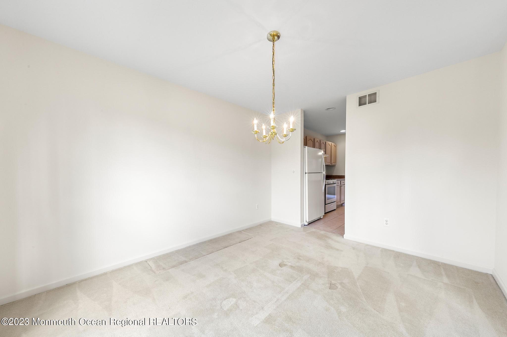 135 Barracuda Road Manahawkin, NJ 08050 - Photo 25 of 47 a view of an empty room with a kitchen