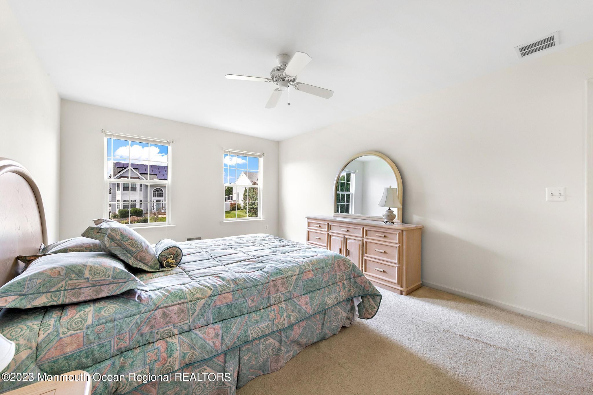 135 Barracuda Road Manahawkin, NJ 08050 - Photo 33 of 47 a bedroom with a bed and window