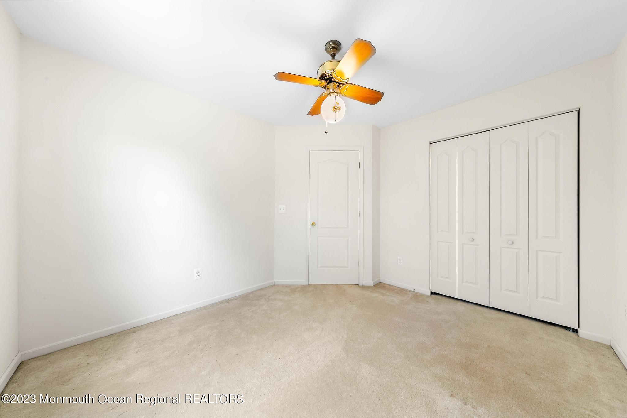 135 Barracuda Road Manahawkin, NJ 08050 - Photo 39 of 47 a view of a room with wooden floor and window