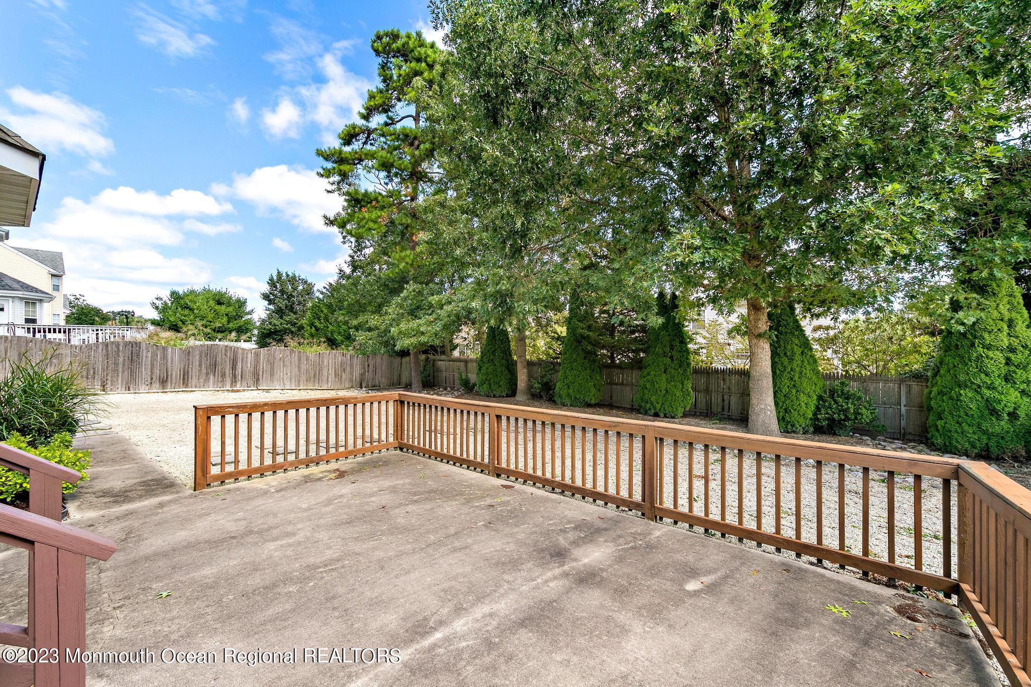 135 Barracuda Road Manahawkin, NJ 08050 - Photo 42 of 47 a view of a roof deck with wooden fence