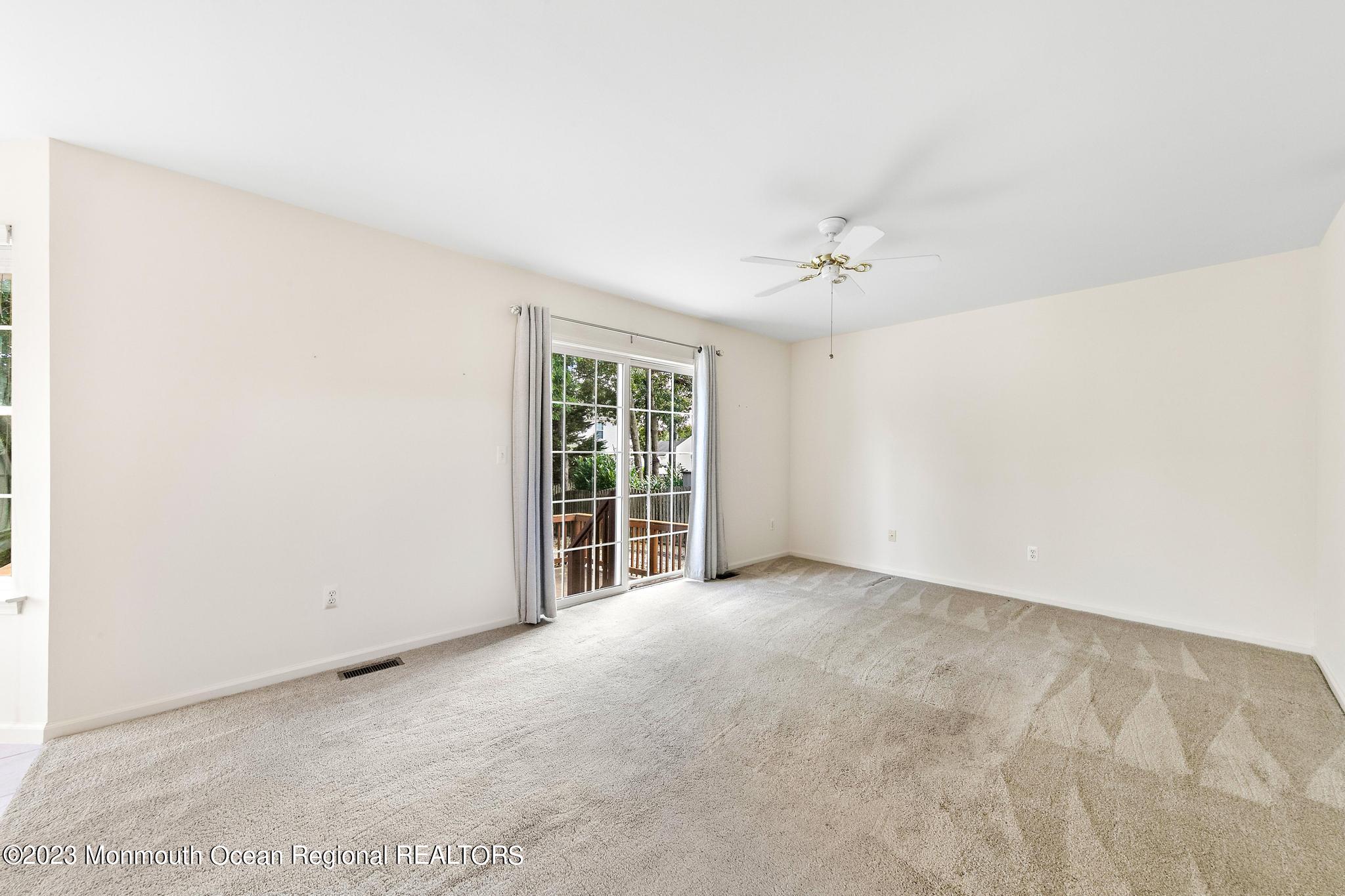 135 Barracuda Road Manahawkin, NJ 08050 - Photo 6 of 47 an empty room with windows and closet