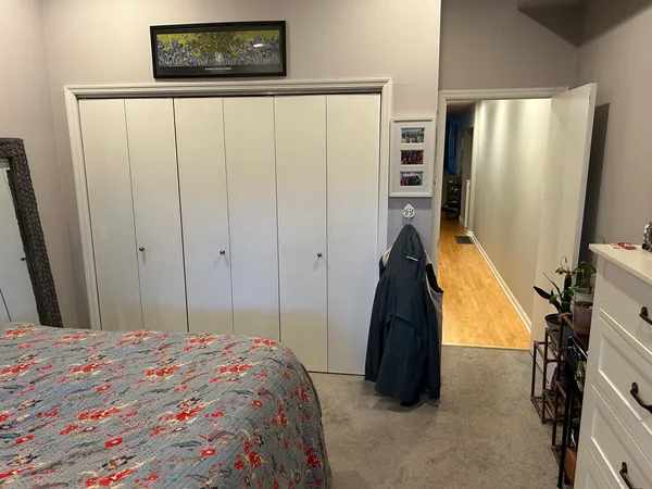 a bedroom with a bed and a closet