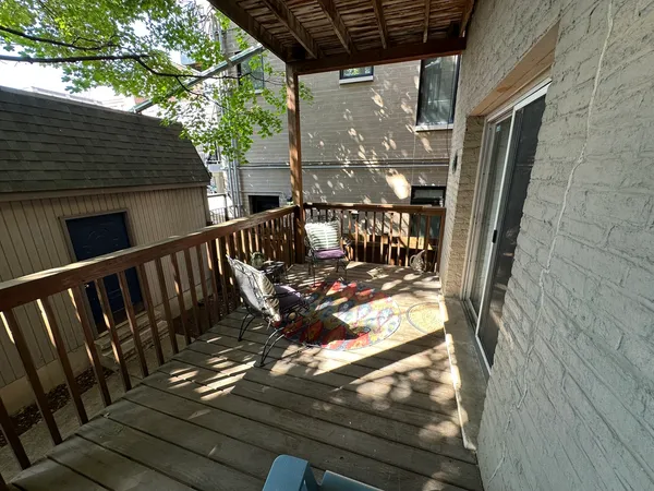 a view of balcony with furniture