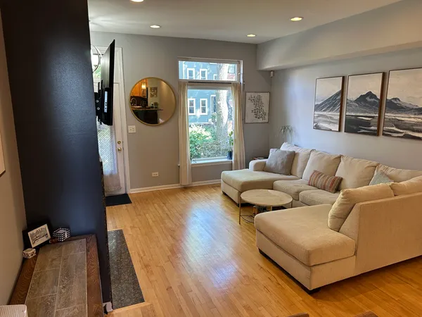 a living room with furniture and a large window