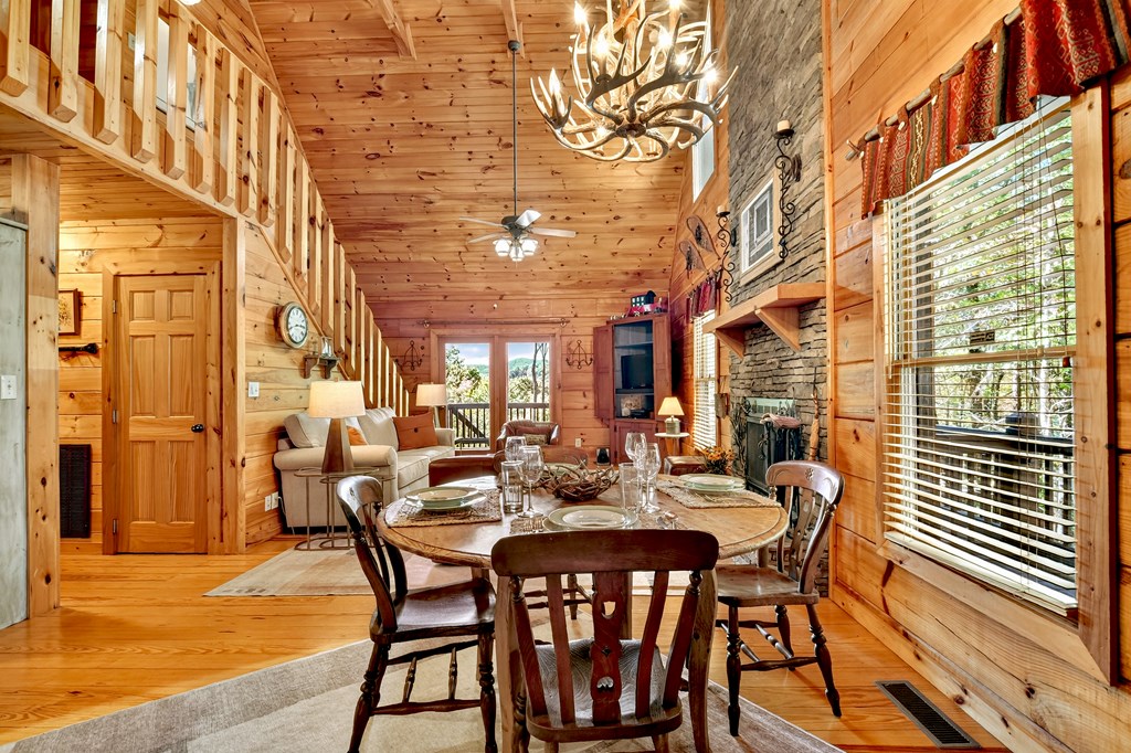 240 Lower Prince Mountain Road Cherry Log, GA 30522 - Photo 20 of 45 a view of a patio with table and chairs and potted plants