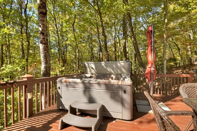 a view of outdoor space with wooden floor and trees