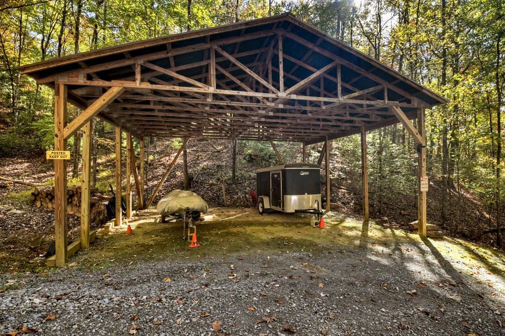 240 Lower Prince Mountain Road Cherry Log, GA 30522 - Photo 45 of 45 a view of a wooden house with a yard