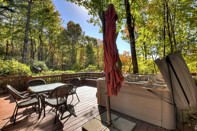 a view of balcony with furniture and garden
