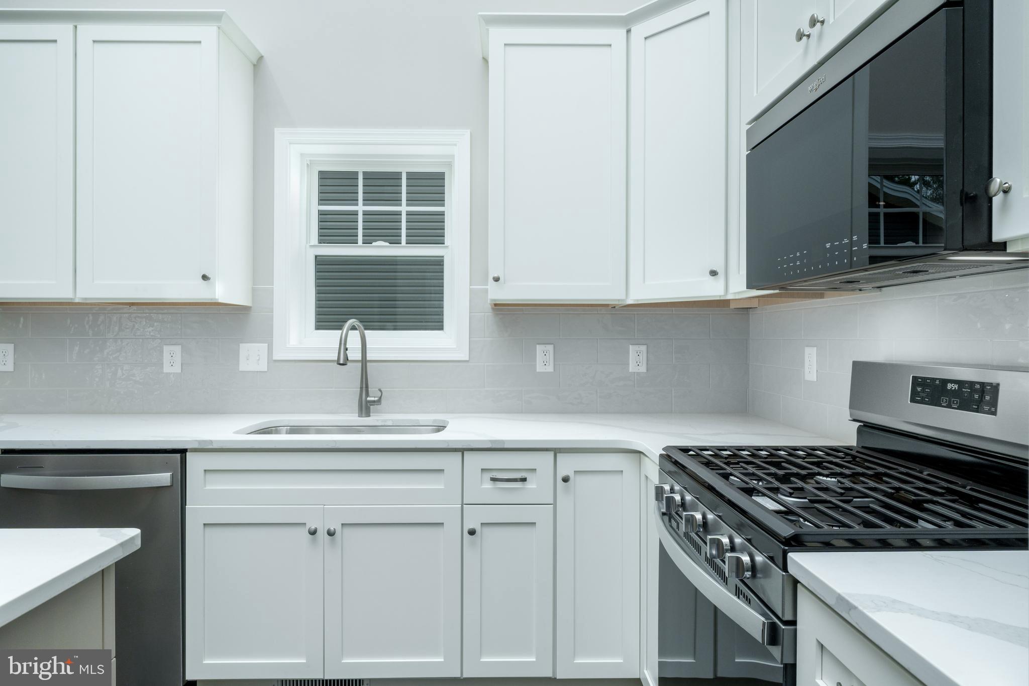 202 Phoebe Road Port Matilda, PA 16870 - Photo 12 of 52 a kitchen with white cabinets and a stove a sink