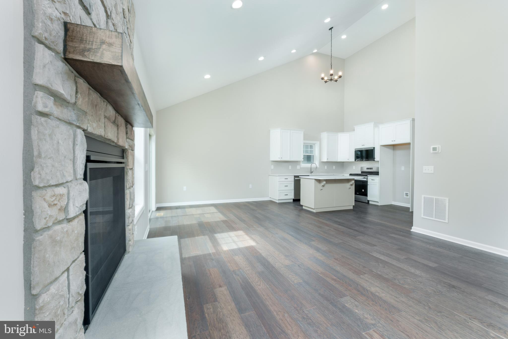 202 Phoebe Road Port Matilda, PA 16870 - Photo 24 of 52 a open kitchen with white cabinets and stainless steel appliances