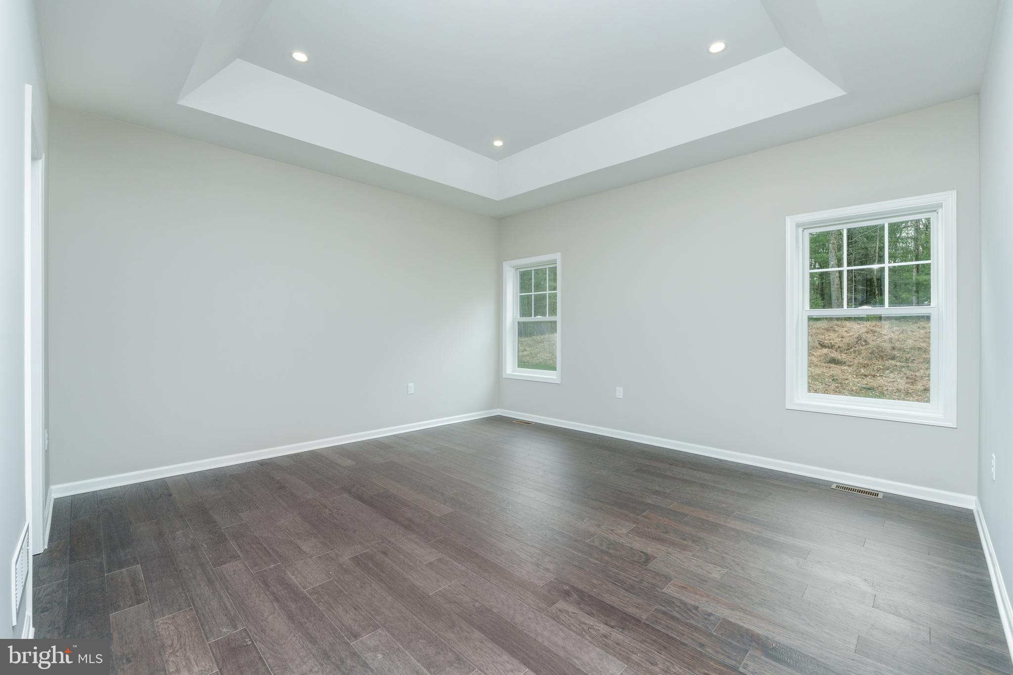 202 Phoebe Road Port Matilda, PA 16870 - Photo 27 of 52 an empty room with wooden floor and windows