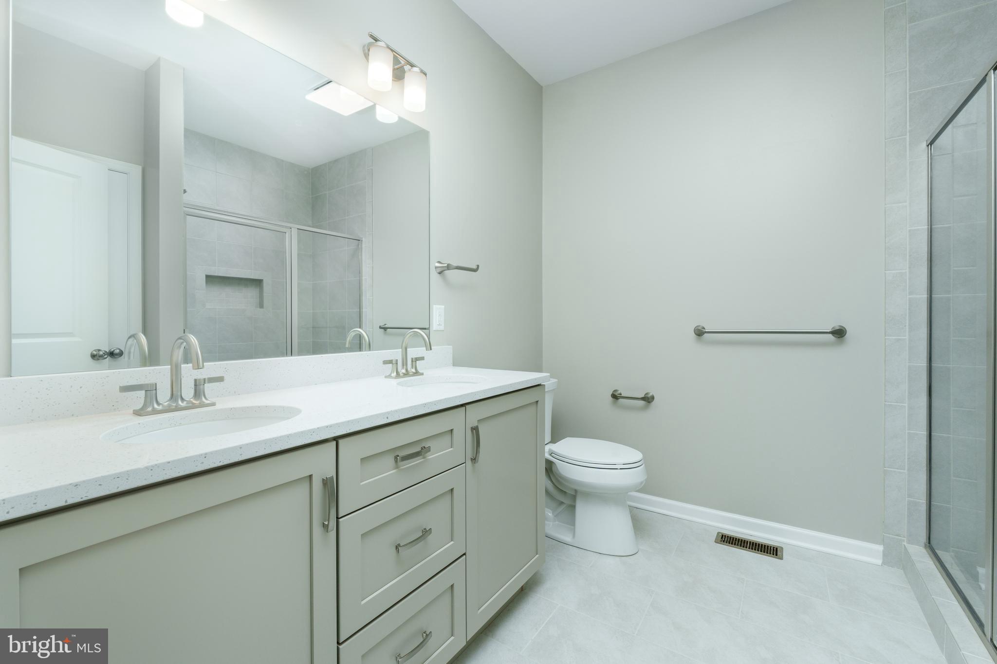 202 Phoebe Road Port Matilda, PA 16870 - Photo 31 of 52 a bathroom with a granite countertop sink a toilet and a mirror