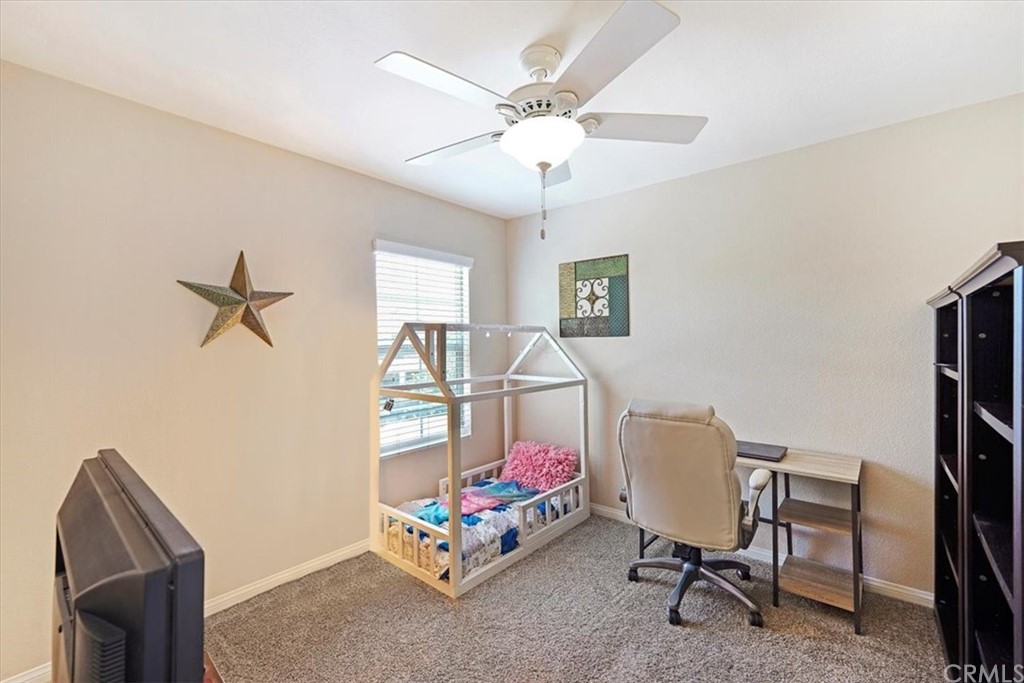 1777 Carrie Way Riverside, CA 92501 - Photo 12 of 35 a bedroom with furniture and a window