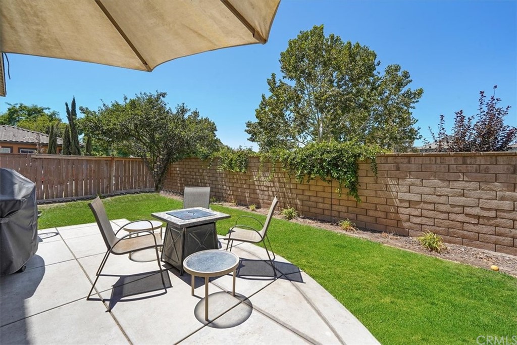 1777 Carrie Way Riverside, CA 92501 - Photo 16 of 35 a view of a chair and table in backyard of the house